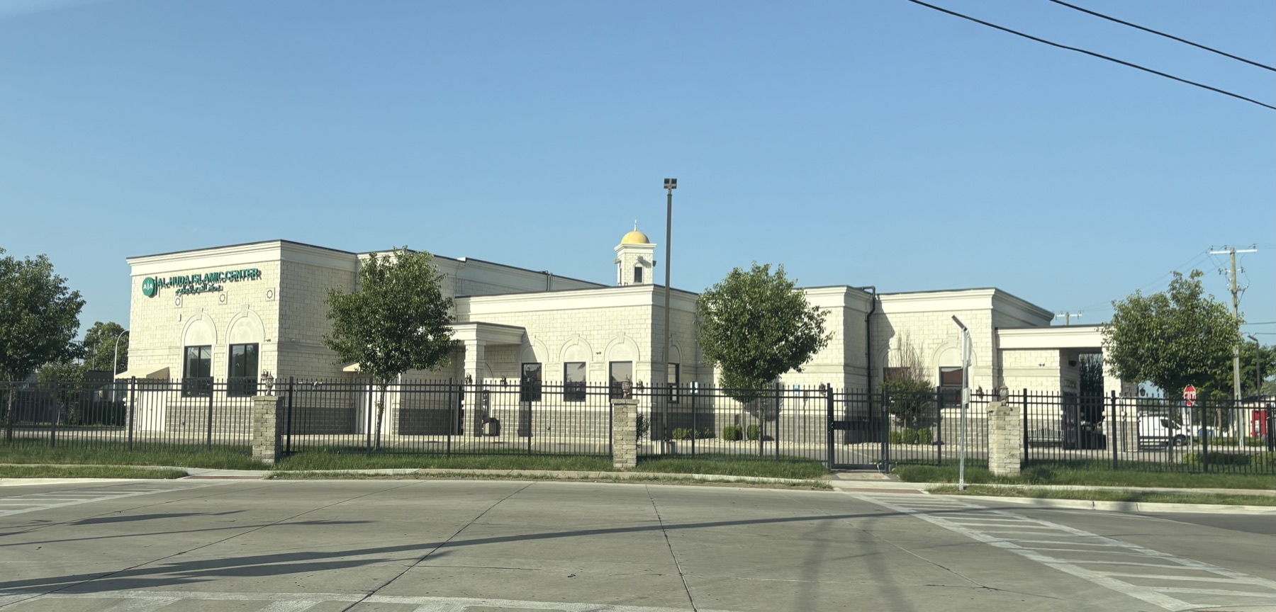 The Al-Huda Islamic Center in Dearborn, a purpose-built stone building with a small gold dome.