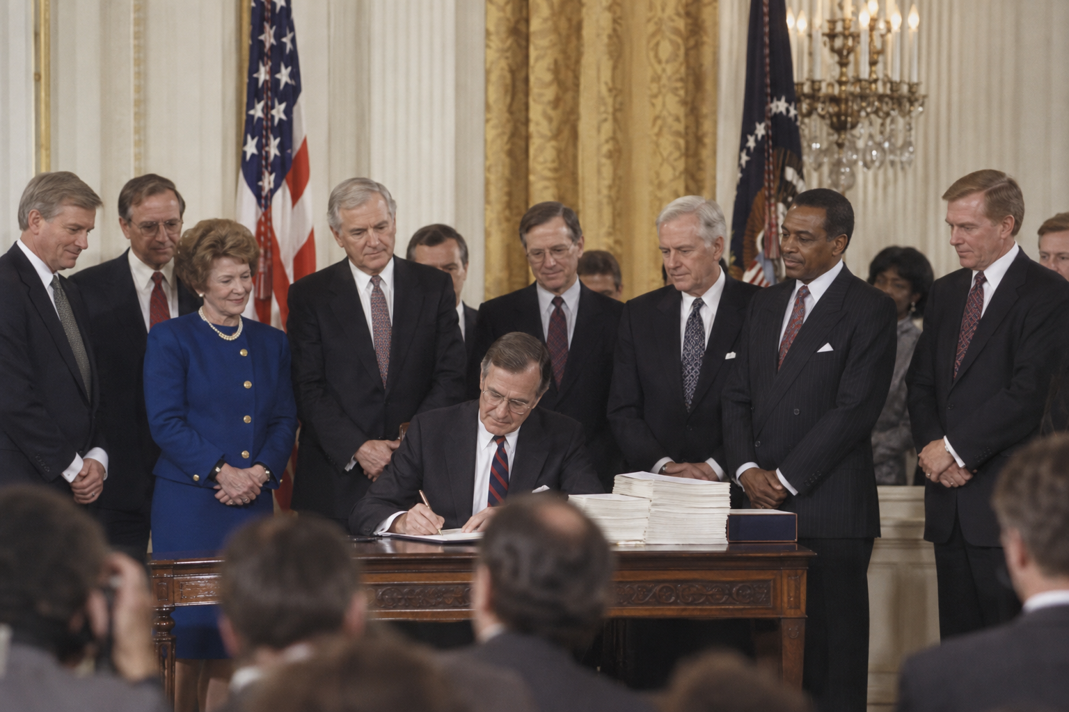 Illustrative 1990 White House immigration-law signing ceremony.