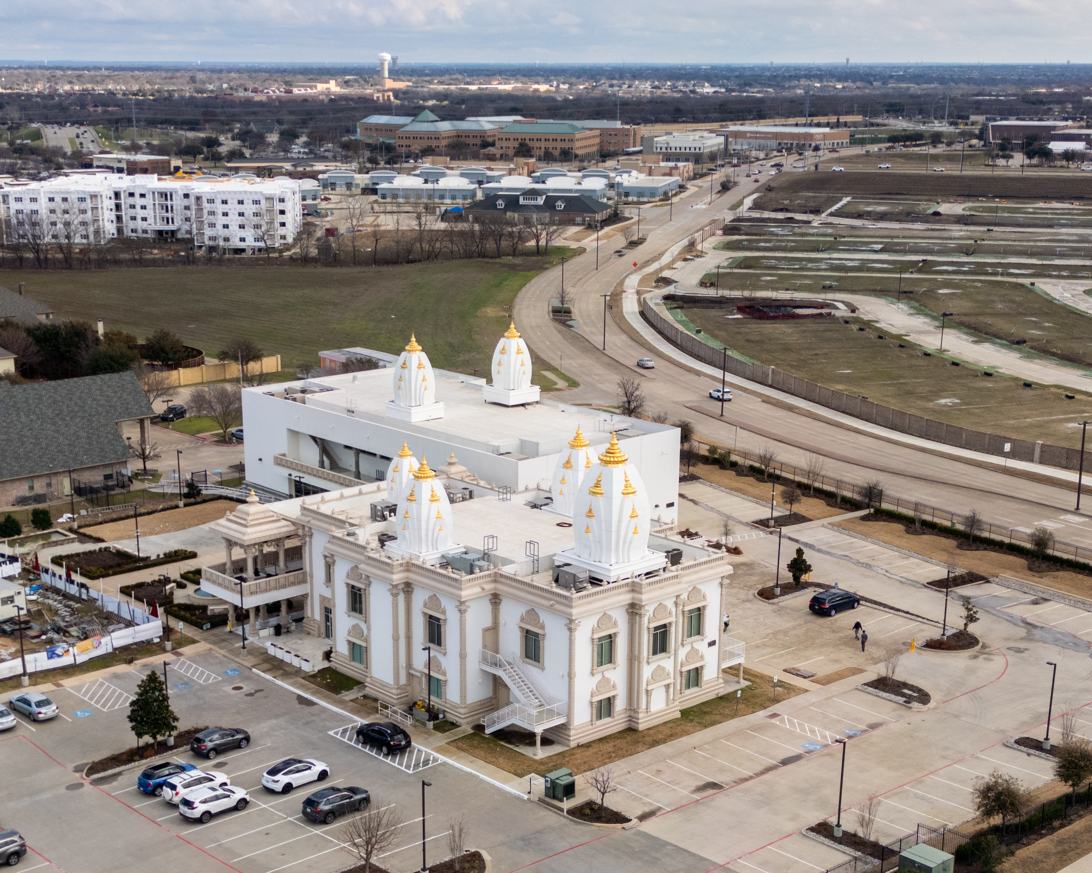 Radha Krishna Temple of Dallas amid suburban development in Allen, Texas. Photographed February 2024.